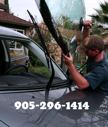 apply new windshield for customer at their home by Hamilton Auto Glass