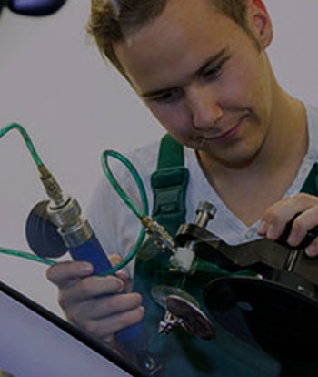Hamilton Auto Glass techician using tools