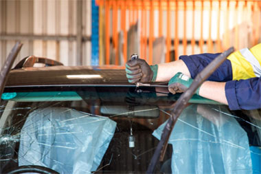 replacing front windshield for silver Honda sedan civic by Hamilton Auto Glass